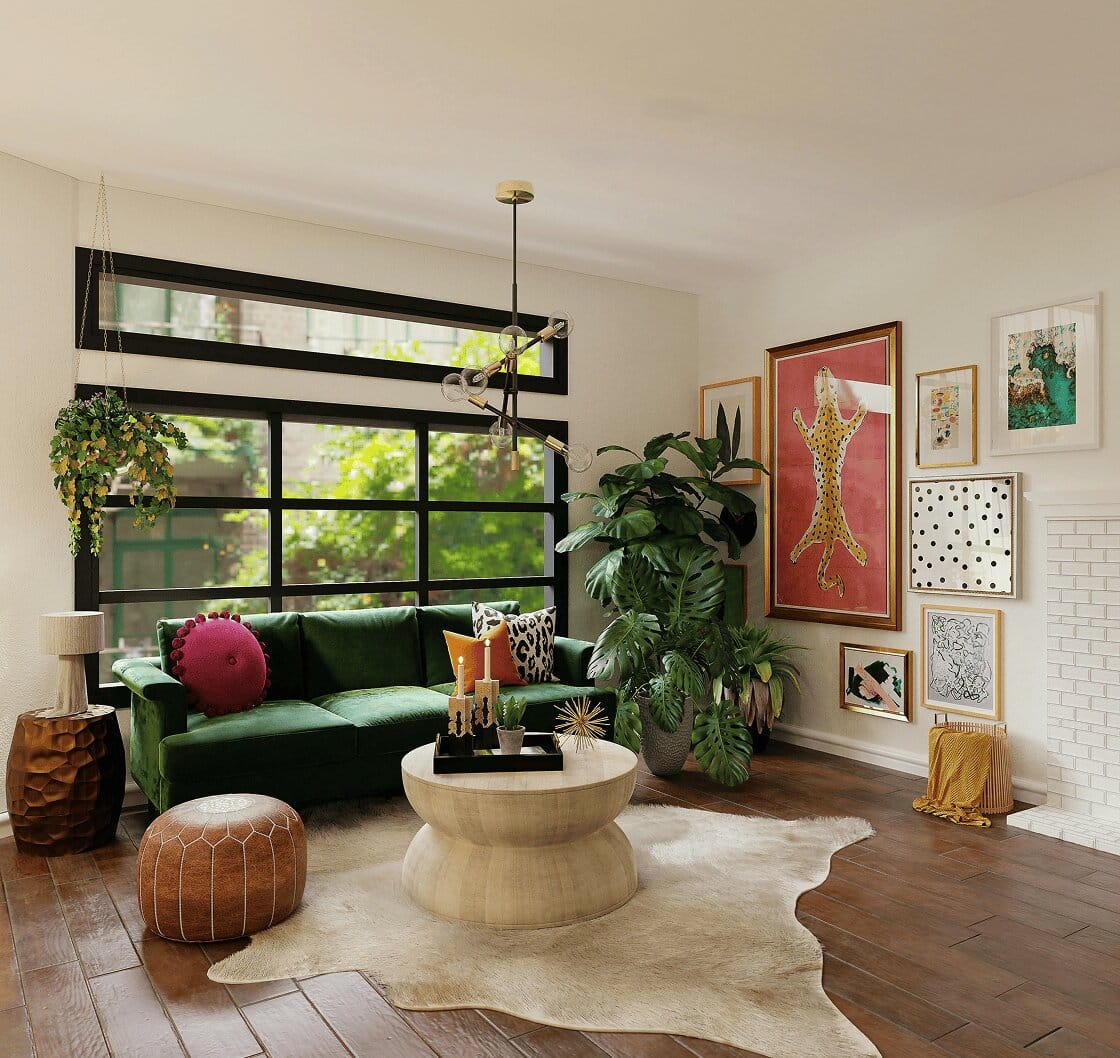 A modern living room features a green velvet couch, a light wood coffee table, and a gallery wall.